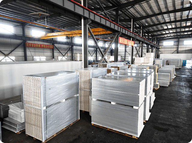 Bulk cleanroom panels stacked in warehouse ready for fast delivery